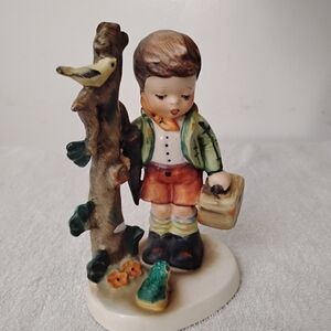 Napco Ceramic Boy Figurine with Bird and Tree Holding Suitcase And Umbrella